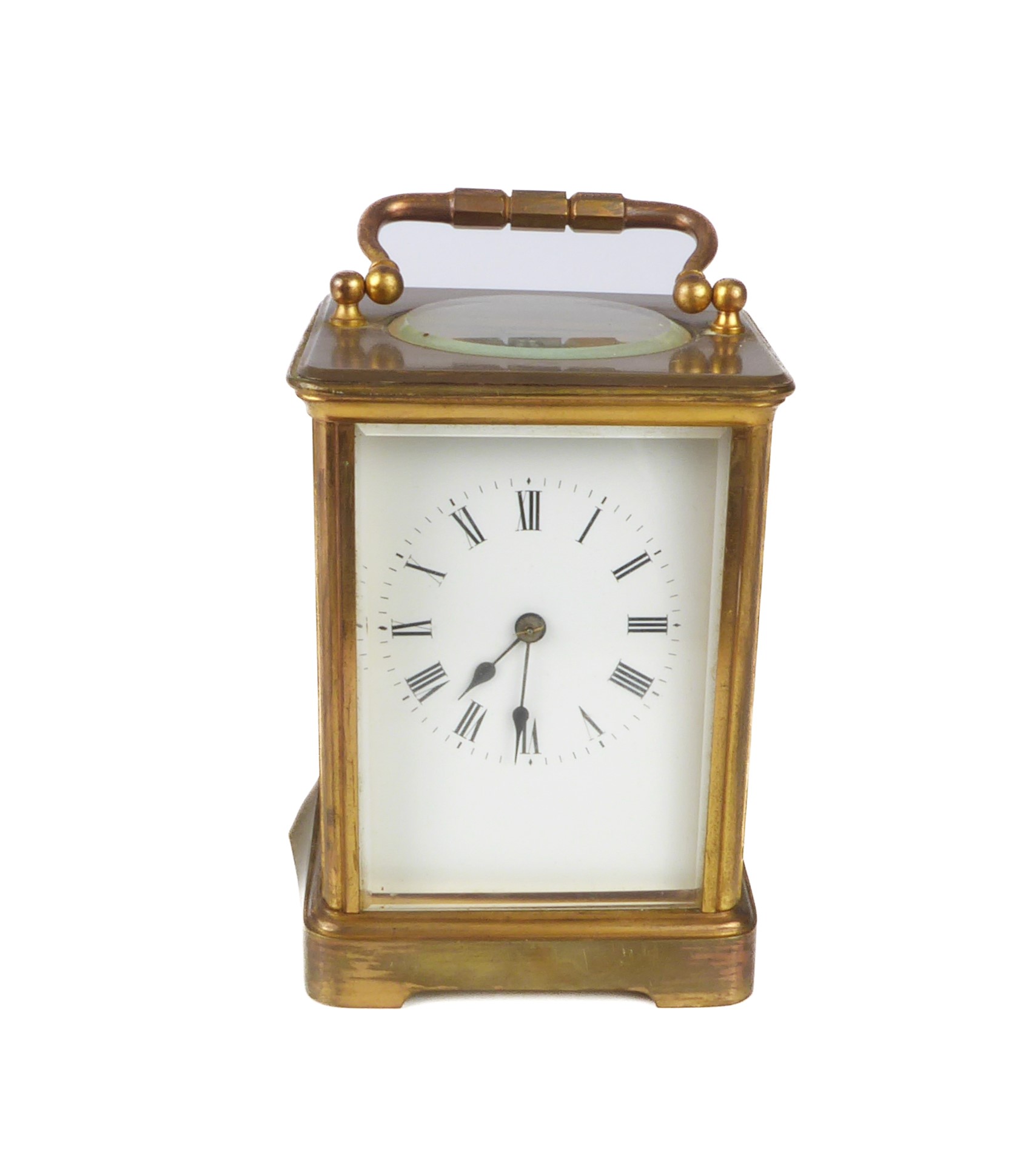 A large brass and bevelled glass carriage clock, marked R&G (18 cm high (handle up). Condition -