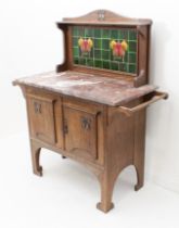 An Arts and Crafts oak and marble tile-back washstand in the manner of Liberty - the tiled camel