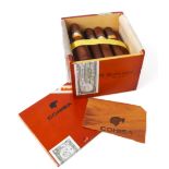 An opened box of Cohiba Robustos cigars (22 cigars) * Please note: These cigars (and also lot 510)