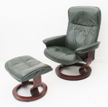 A dark-green leather 'Stressless' style reclining chair and matching foot stool - on circular