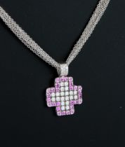 An 18ct white gold pink sapphire and diamond pendant necklace - stamped '750 80 Serkos', the