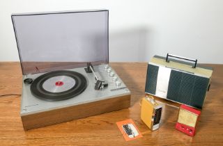 A vintage 1960s Philips portable 'suitcase' style record player - 3 speed for 33, 45 and 78rpm, with