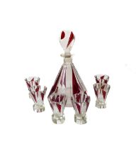 An Art Deco ruby flashed glass liqueur decanter and shot glasses - 1920s-30s, the conical, twelve-