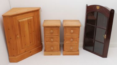 A pair of pine three drawer bedside cabinets - (LWH 31.5 x 32 x 51cm.); together with a pine hanging