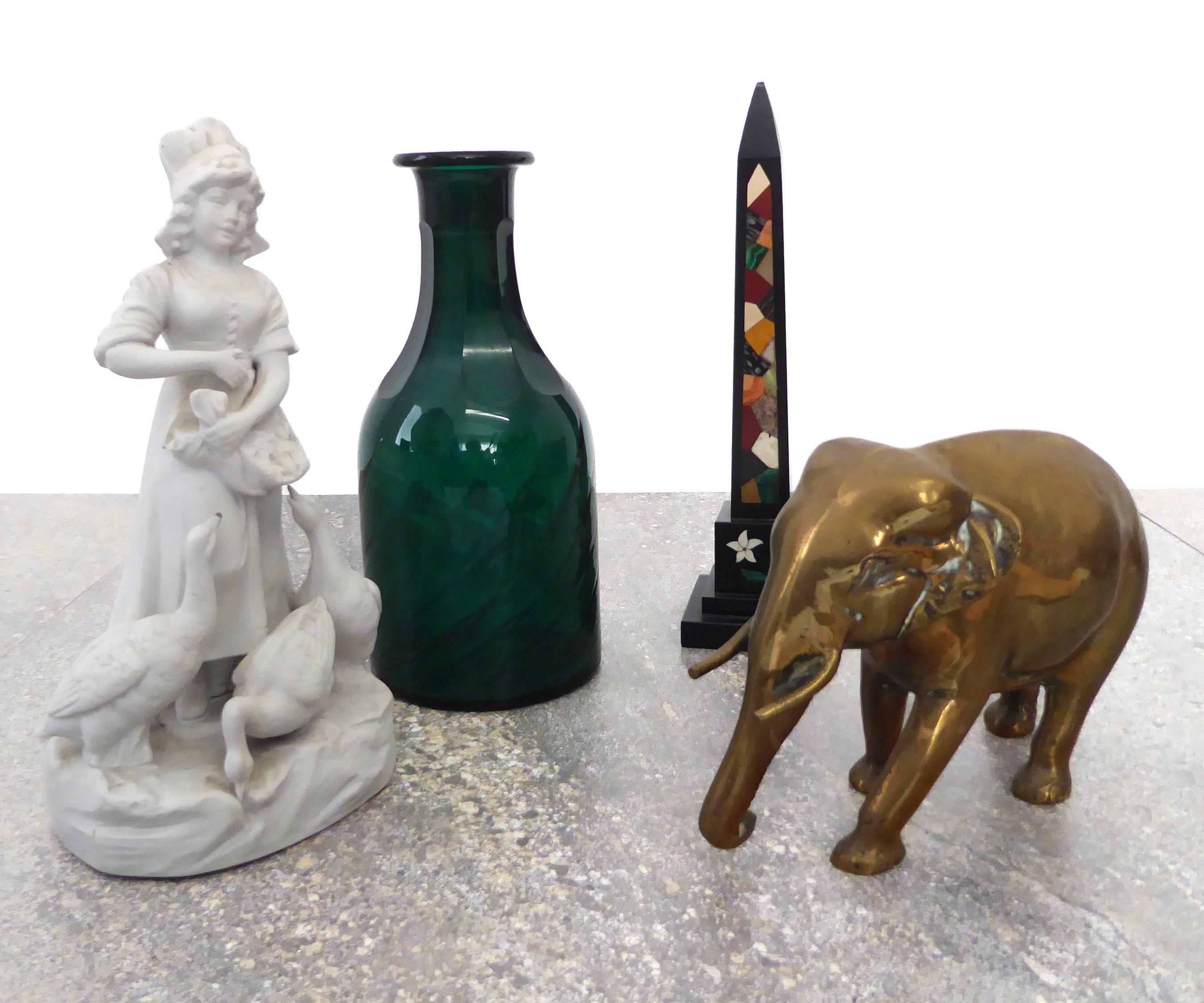 A  mixed lot comprising a brass elephant, a Parian figure of a goose girl, a green glass carafe