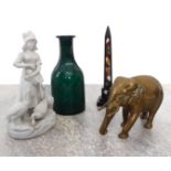 A  mixed lot comprising a brass elephant, a Parian figure of a goose girl, a green glass carafe