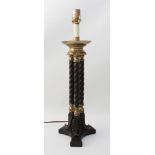 A bronzed and parcel-gilt triple-column lamp in the Regency style - modern, the dished top on