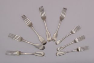 Five 19th century silver fiddle pattern table forks - including a pair by Robert Williams, Exeter