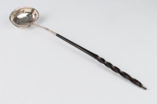 A George IV silver toddy or punch ladle - London 1825, maker's mark rubbed, with chased foliate