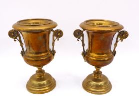 A pair of 18th century style brass urns - early 20th century, with twin floral scroll handles and