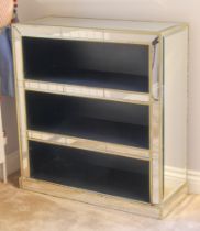 An Art Deco style mirrored open bookcase - with bevelled mirrored top, giltwood edges and three open