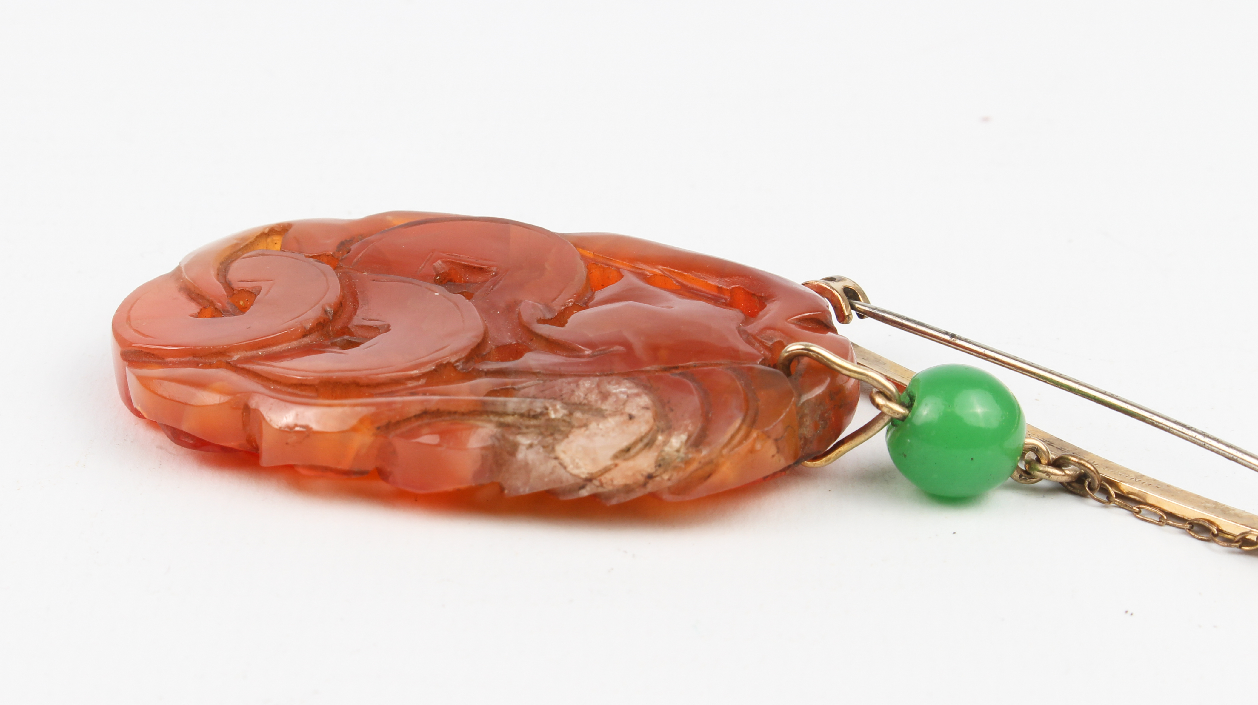 A mid-century Chinese carved jade plaque on bar brooch - the ovoid, russet jade plaque pierced and - Image 8 of 13