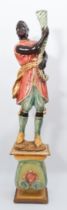 A polychrome painted and parcel gilt composite Blackamoor torchere - late 20th century, the figure
