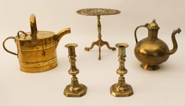 Five pieces of brassware: a heavy Indian teapot of flattened globular form with tower-shaped neck