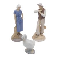 A pair of Bing & Grondhal porcelain figures of farmers by Axel Locher - no. 2049 and 2050, both