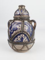 A white-metal band Iznik or Persian covered vase (19 cm high, 12 cm wide)