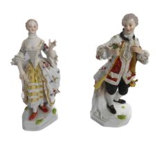 A pair of early 20th century Meissen porcelain figures of a lady and gallant - in 18th century
