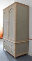 A 19th century style painted pine linen press - the shallow moulded top over a pair of arched