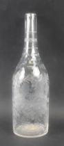 A late Georgian magnum size bottle decanter - cut and wheel engraved, the body cut with fruiting