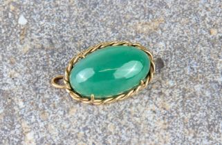 A 9ct gold and aventurine pendant brooch - the oval, cabochon aventurine within a rope-twist border,