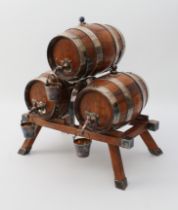 A coopered oak and silver-plated three-barrel tabletop spirit dispenser stand - early 20th