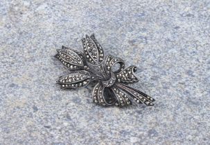 A silver and marcasite tulip bouquet brooch - 1930s-40s, stamped 'SILVER', 59mm long.