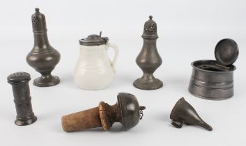 Six pieces of pewter and a porcelain mustard pot with pewter lid, the larger caster 14 cm high.