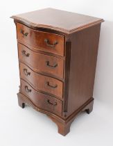 A repoduction Georgian style mahogany serpentine chest of small proportions - the cross banded,