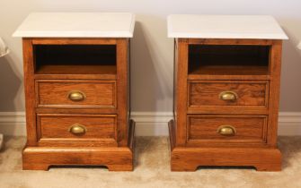 A pair of oak and marble bedside cabinets to match the previous lot - in the 19th century, with