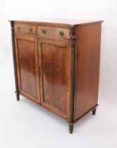 A Regency mahogany chiffonier - the rectangular top with outset front angles, on foliate carved