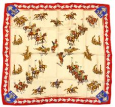 A boxed silk scarf by L.R. of Paris - titled 'Le Carrousel de Saumur', depicting equine military