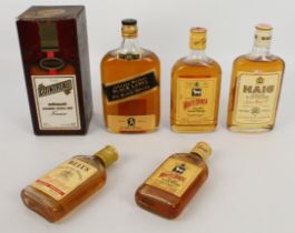 A small collection of vintage bottles of blended Scotch whisky - Johnnie Walker Black Label Extra