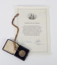 A Hollandia silver 'piece of eight' medallion with certificate