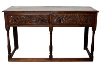 An early 18th century and later joined oak dresser base of small proportions - the moulded, single