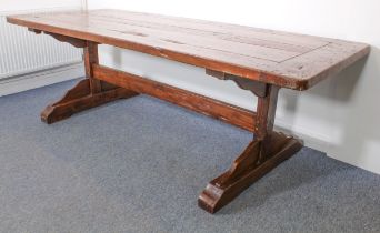 A fine teak refectory-style dining table - the richly coloured, cleated, five-plank top on trestle