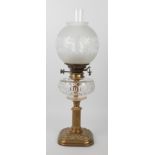 An Edwardian brass and cut glass oil lamp by Hinks & Sons for Maple of London, the rounded square