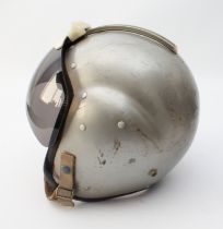 A 1960s RAF pilot's 'bone dome' flight helmet - complete with leather 'donut' headphones and