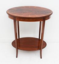 An Edwardian mahogany and marquetry oval two-tier occasional table - the flame mahogany top with a