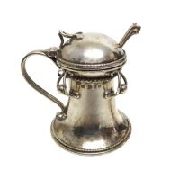 An Arts & Crafts silver lidded mustard pot and spoon by Omar Ramsden - London 1933, of capstan