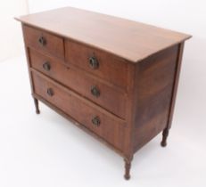 A French early 20th century mahogany chest of drawers - the moulded top over two short and two