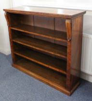 A mid-19th century burr walnut open bookcase - the well figured top on boldly carved foliate