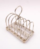 An Edwardian silver six division toast rack - Mappin & Webb, Sheffield 1903, with arched dividers,