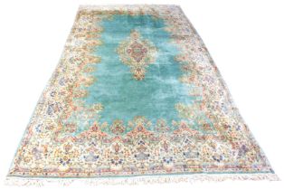 A large Persian Kerman Imperial wool carpet - with a central diamond-shaped floral and foliate