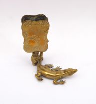 A late 19th century novelty brass lizard match striker - the well detailed lizard with raised