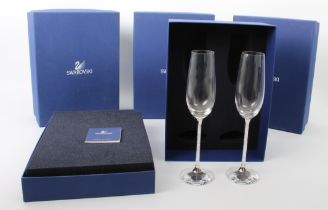 A set of eight Swarovski Crystalline champagne toasting flutes - each glass with an elongated