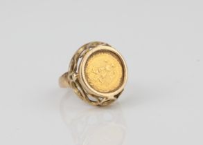 A 9ct gold ring set with a 1945 Mexico 2 Pesos gold coin - hallmarked Birmingham 1979, size J½,