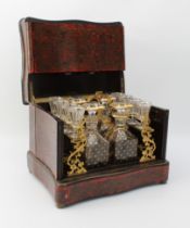 An early 19th century French Boulle-style cave à liqueur or travelling decanter set - the serpentine