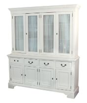 A painted pine glazed dresser or library bookcase - painted off-white, the flared dentil cornice