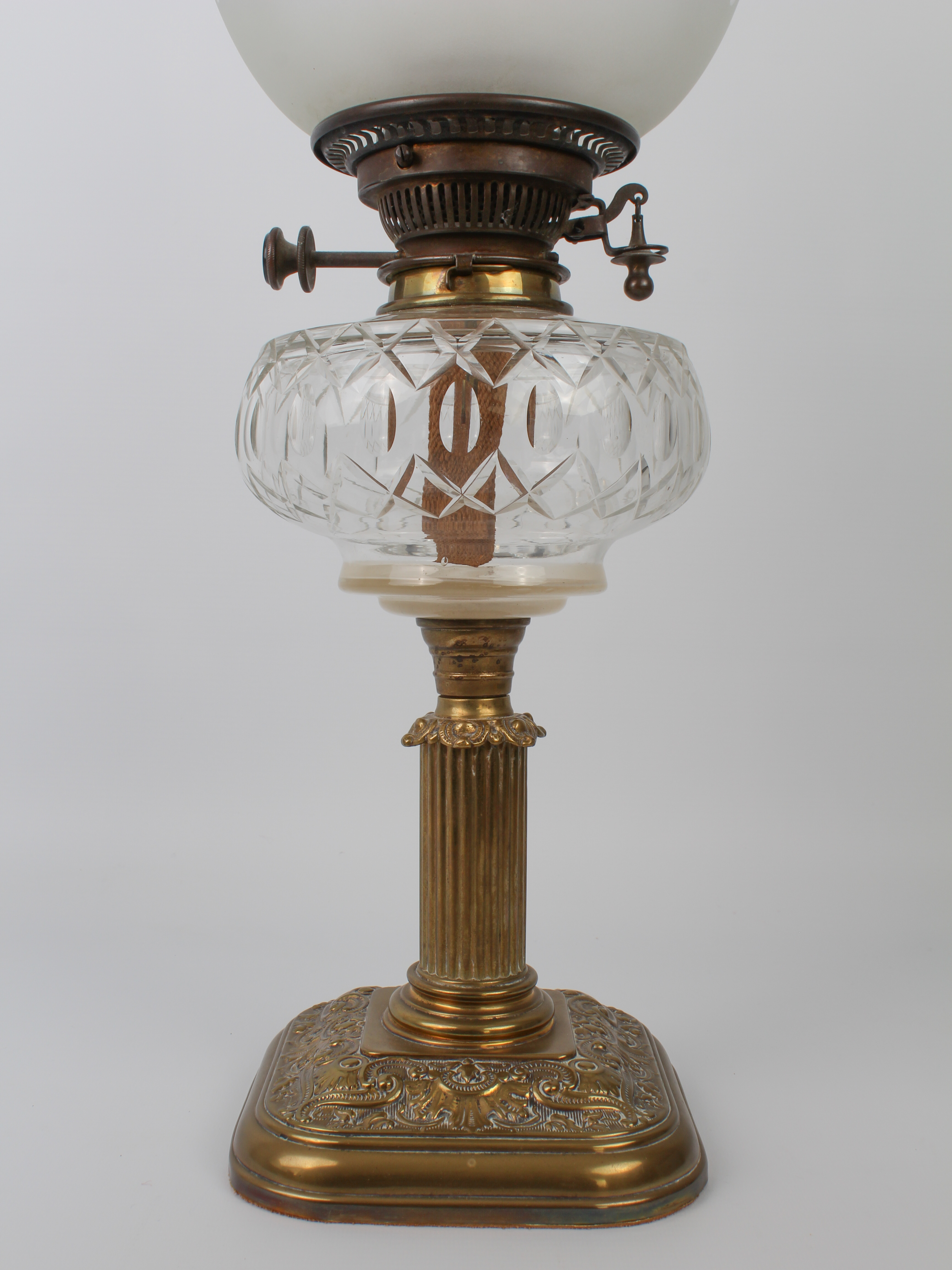 An Edwardian brass and cut glass oil lamp by Hinks & Sons for Maple of London, the rounded square - Image 2 of 4