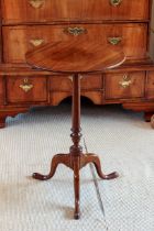 A George III mahogany tilt top tripod table - the plain circular top on a slender turned gun